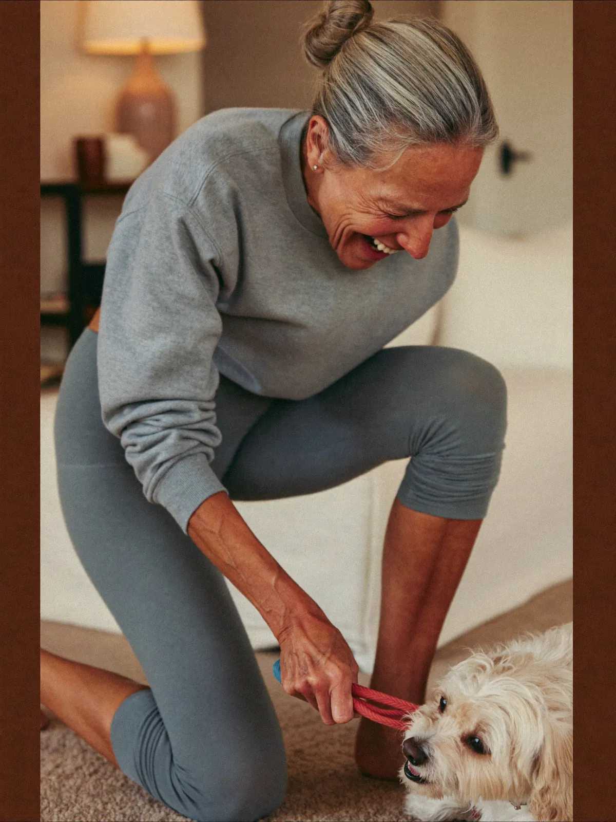 Kneeling comfortably on the living-room floor