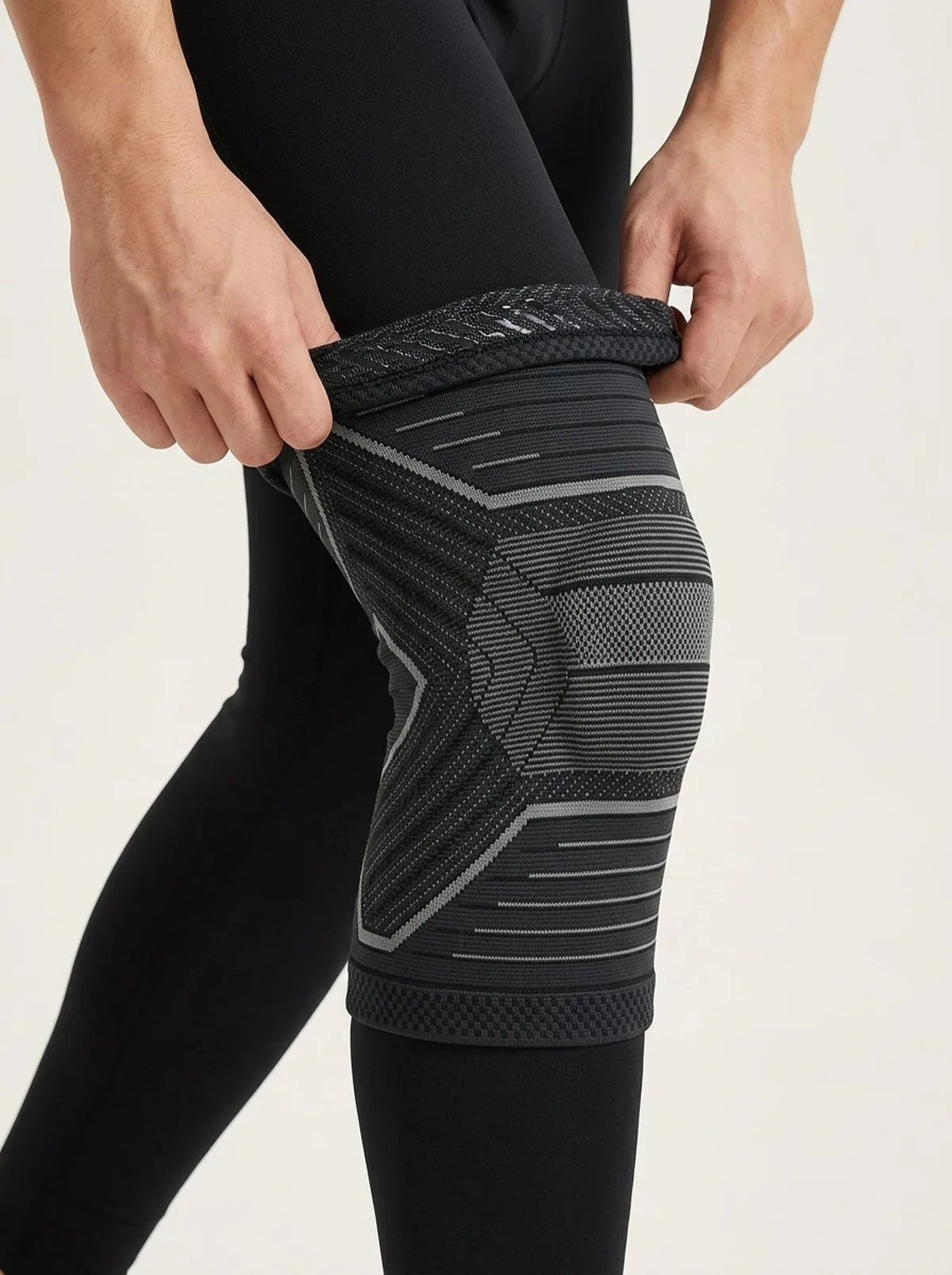 Sliding the sleeve up over the knee